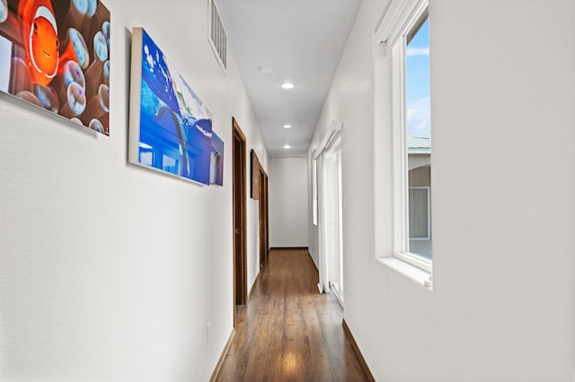 corridor featuring dark wood-type flooring