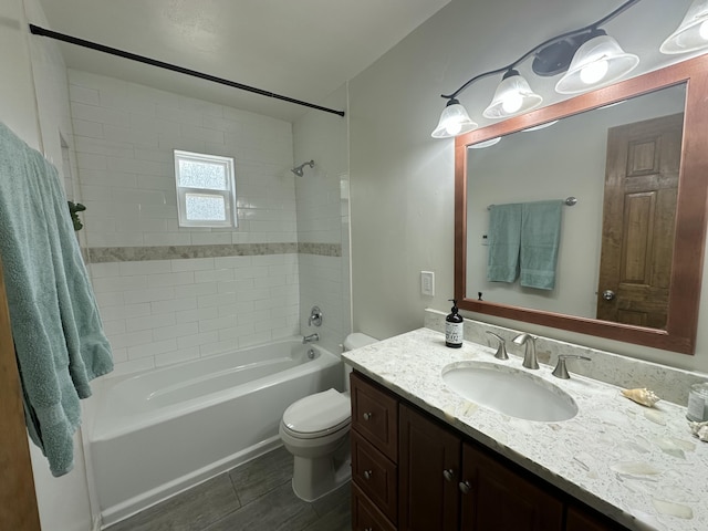 full bathroom featuring shower / tub combination, vanity, and toilet