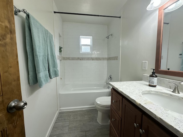 bathroom with toilet, shower / bathing tub combination, vanity, and baseboards