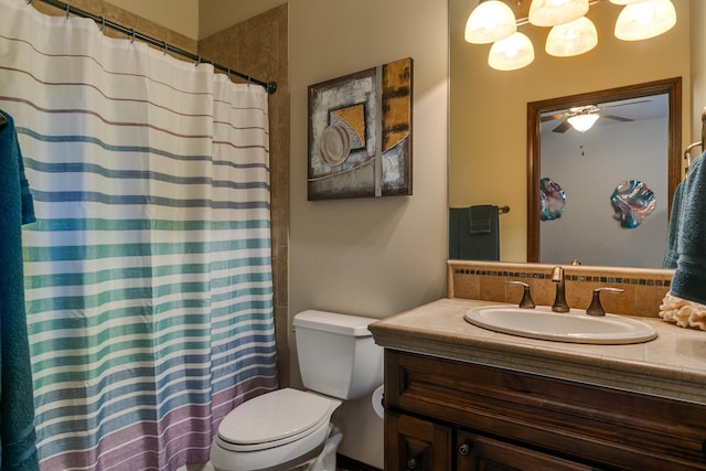 bathroom with toilet, a shower with shower curtain, a ceiling fan, and vanity