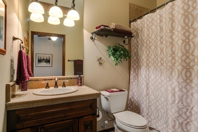 full bath featuring toilet, a shower with curtain, and vanity