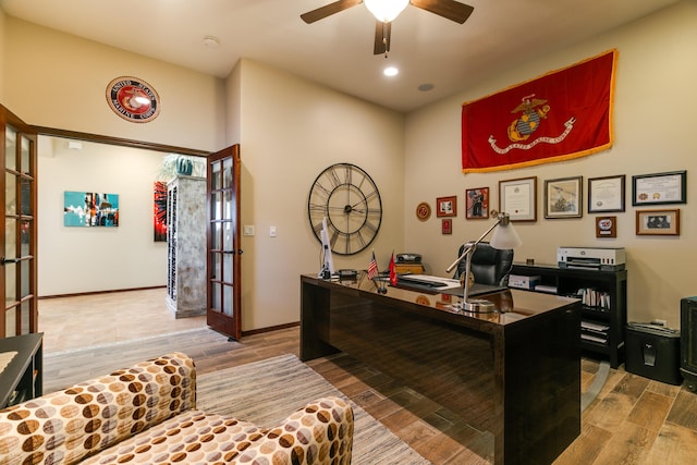 home office featuring french doors, wood finished floors, a ceiling fan, and baseboards