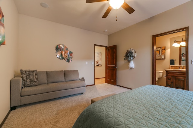 bedroom featuring a ceiling fan, carpet flooring, connected bathroom, and baseboards