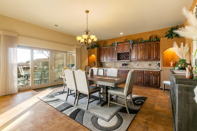 dining space with a chandelier