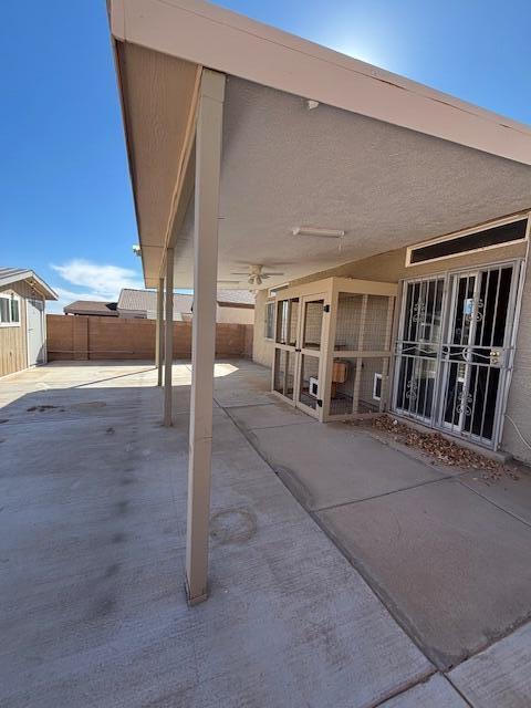 view of patio / terrace featuring fence