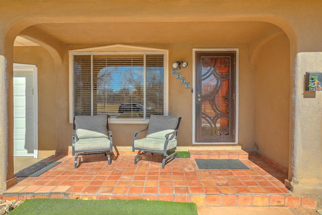 property entrance featuring a patio area