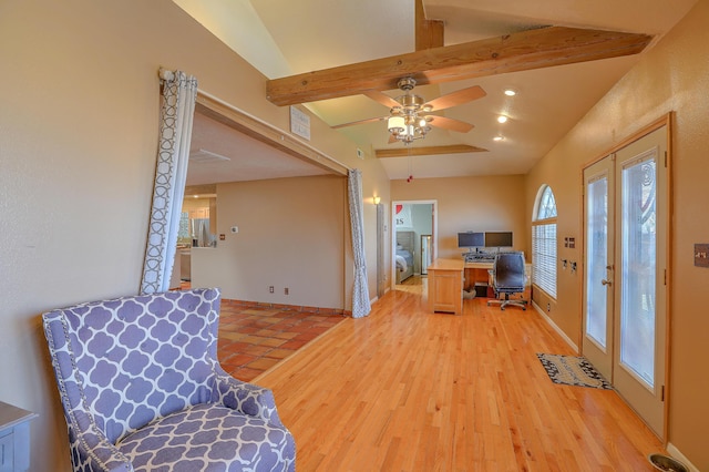 home office featuring ceiling fan, light wood-type flooring, vaulted ceiling with beams, and french doors