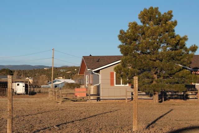 view of side of home with fence