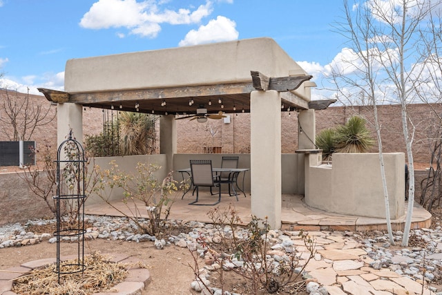 view of patio featuring ceiling fan and a gazebo