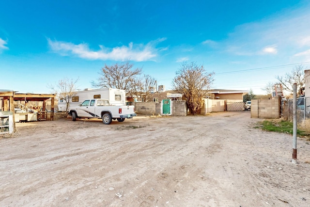 exterior space featuring a gate and fence