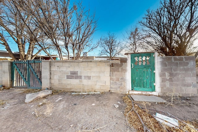 exterior space with fence and a gate