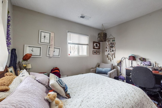 bedroom featuring visible vents