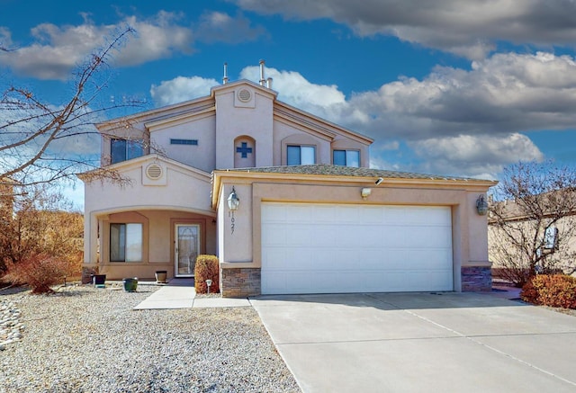 view of front of property with a garage, concrete driveway, stone siding, and stucco siding