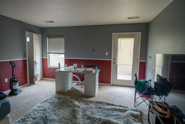 office space with carpet flooring and visible vents