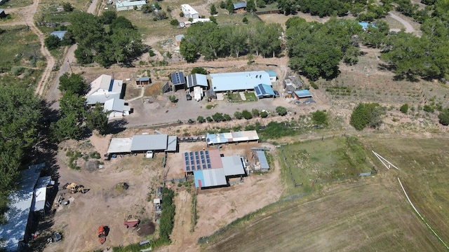 birds eye view of property with a rural view