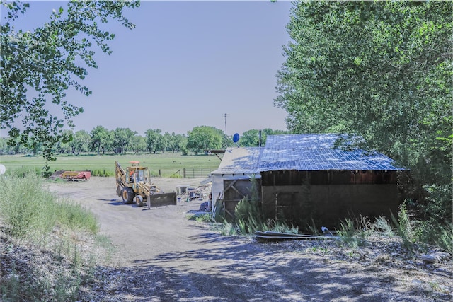 exterior space with a rural view