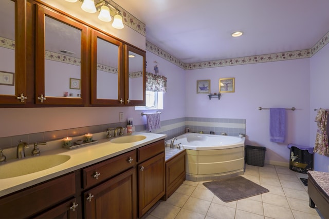 full bathroom with a garden tub, double vanity, a sink, and tile patterned floors