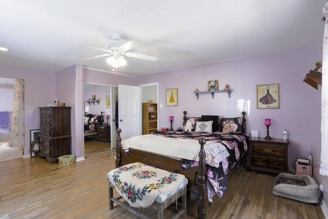 bedroom with ceiling fan and wood finished floors