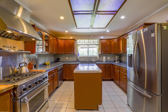 kitchen with island range hood, tile countertops, glass insert cabinets, a center island, and stainless steel appliances