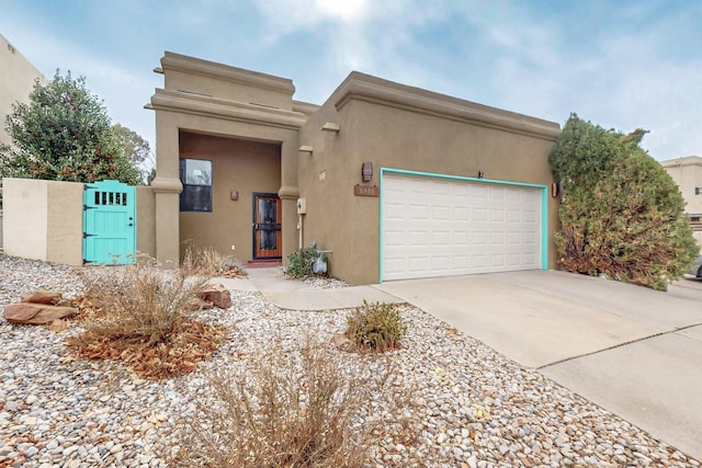 adobe home featuring a garage