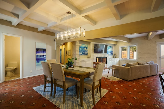 dining area with a brick fireplace, coffered ceiling, beamed ceiling, and a notable chandelier