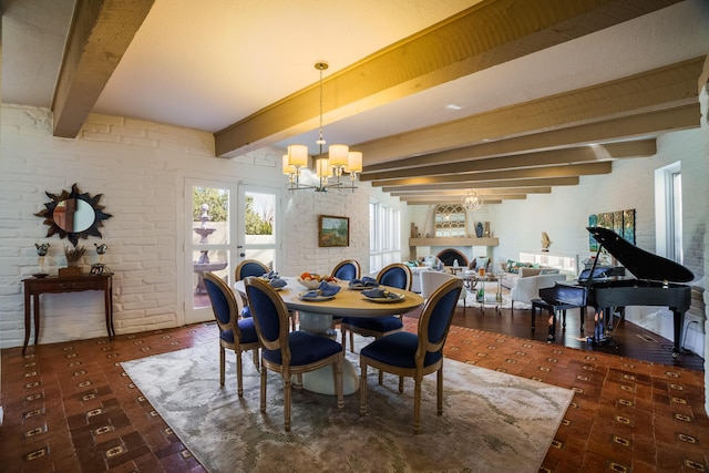 dining room with french doors, beamed ceiling, a chandelier, and brick wall