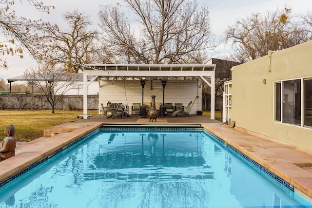 view of swimming pool featuring a patio area