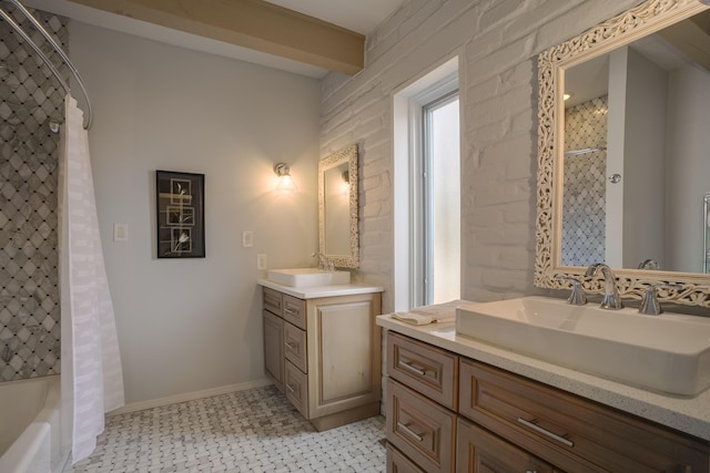 bathroom featuring beam ceiling, vanity, and shower / tub combo