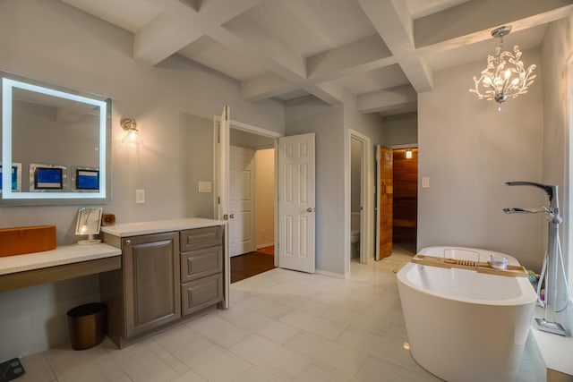 bathroom featuring beamed ceiling, a bath, toilet, and coffered ceiling