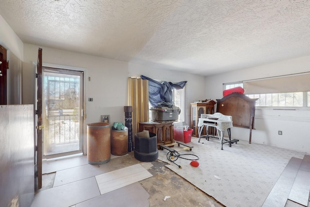 interior space with a textured ceiling and a wealth of natural light