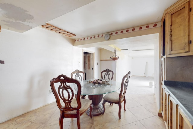 dining area featuring light tile patterned flooring