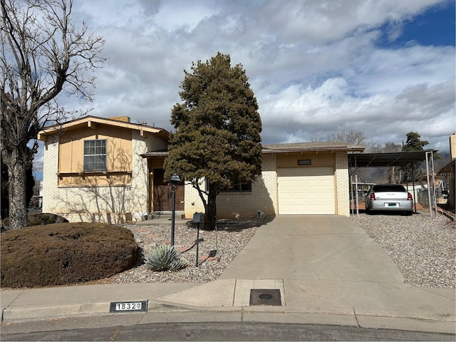 view of front of house with a carport and a garage