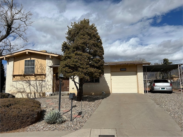 view of front of home featuring a carport and a garage