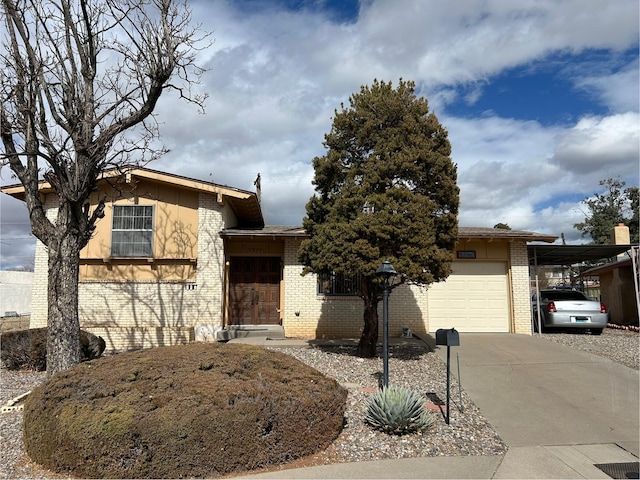 view of front of home featuring a garage and a carport