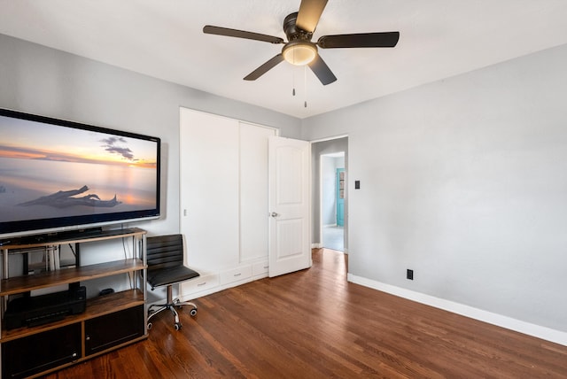 office space with ceiling fan and dark hardwood / wood-style floors