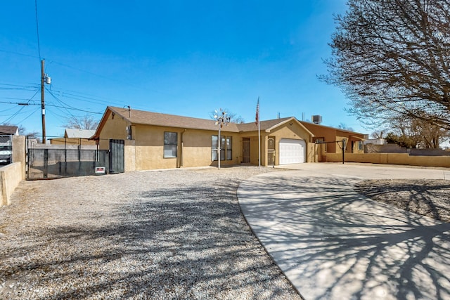 ranch-style house featuring a garage