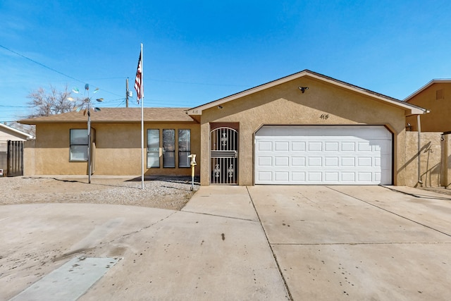 ranch-style home featuring a garage