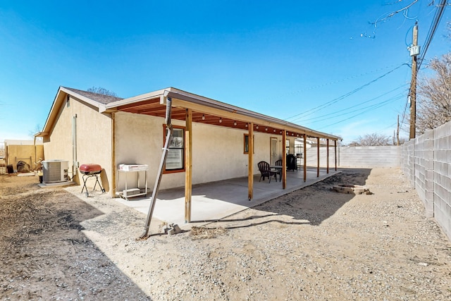 exterior space with a patio and cooling unit