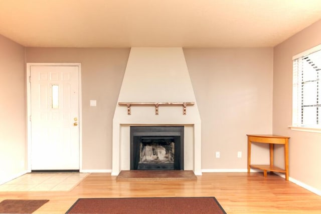 unfurnished living room with wood-type flooring