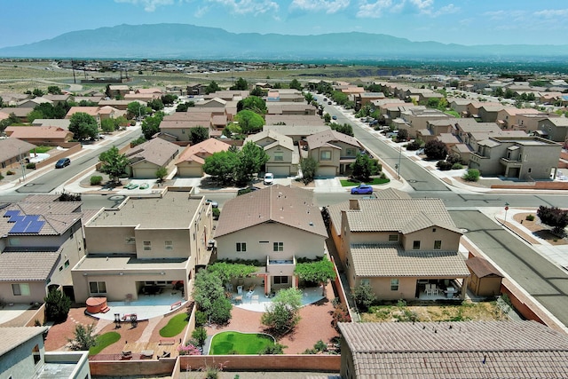 drone / aerial view with a residential view and a mountain view