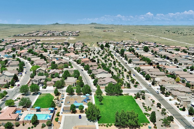 drone / aerial view featuring a residential view and a mountain view