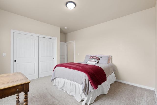 carpeted bedroom featuring a closet