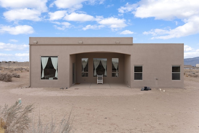 back of property featuring a patio area