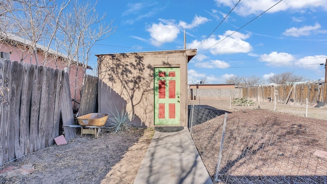 view of shed with a fenced backyard