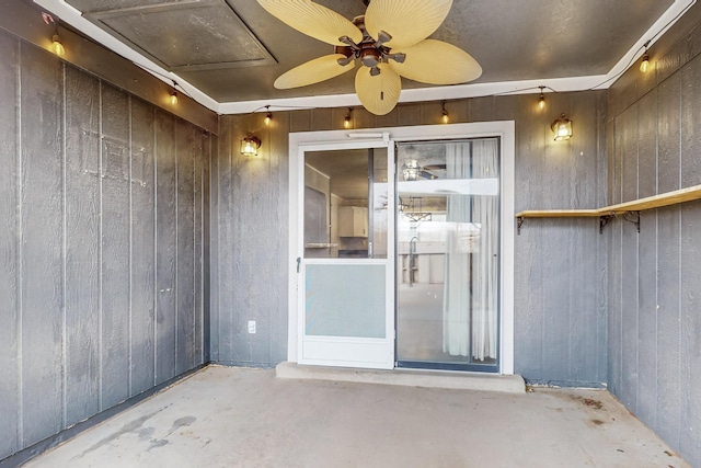 doorway to property featuring a patio area and ceiling fan