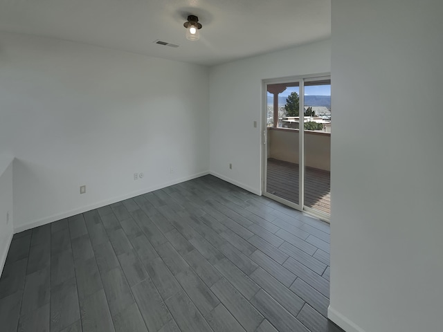 6737 Gleason Ave NW, Albuquerque, NM 87120 - unfurnished room with wood finished floors, visible vents, and baseboards