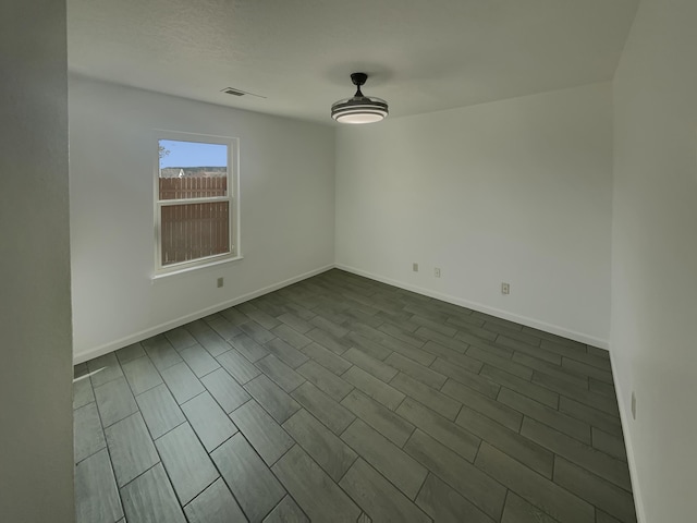 6737 Gleason Ave NW, Albuquerque, NM 87120 - unfurnished room with visible vents and baseboards