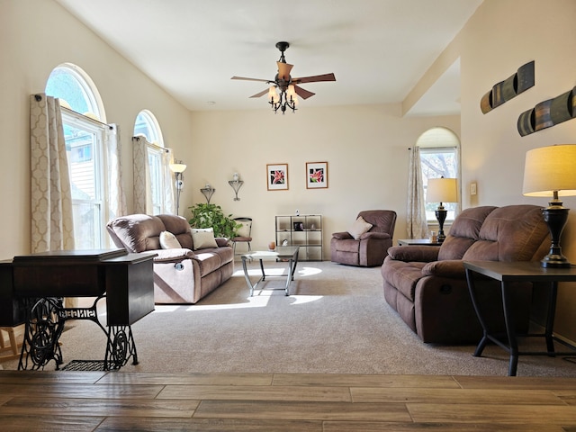 living area featuring light wood-type flooring and ceiling fan