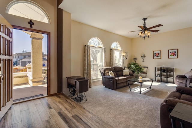 living area with ceiling fan and wood finished floors