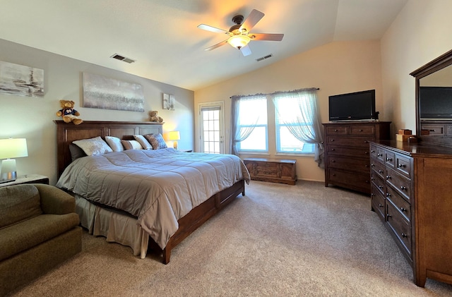 bedroom with visible vents, vaulted ceiling, a ceiling fan, and light colored carpet